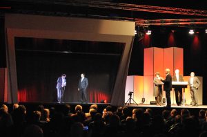 3D hologram speaker presentation during a live corporate event.