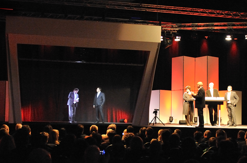 3D hologram speaker presentation during a live corporate event.