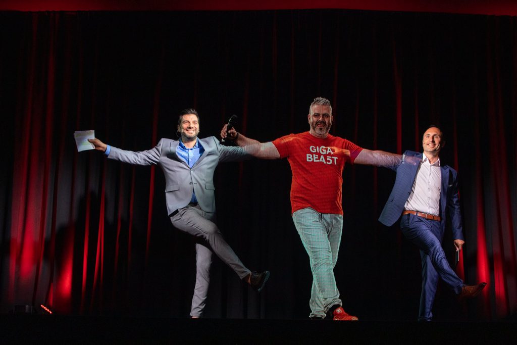 three men are dancing